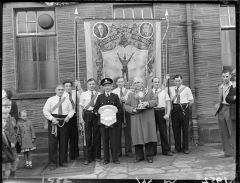 1950 Men holding Dr. Pit Banner   Miners Picnic